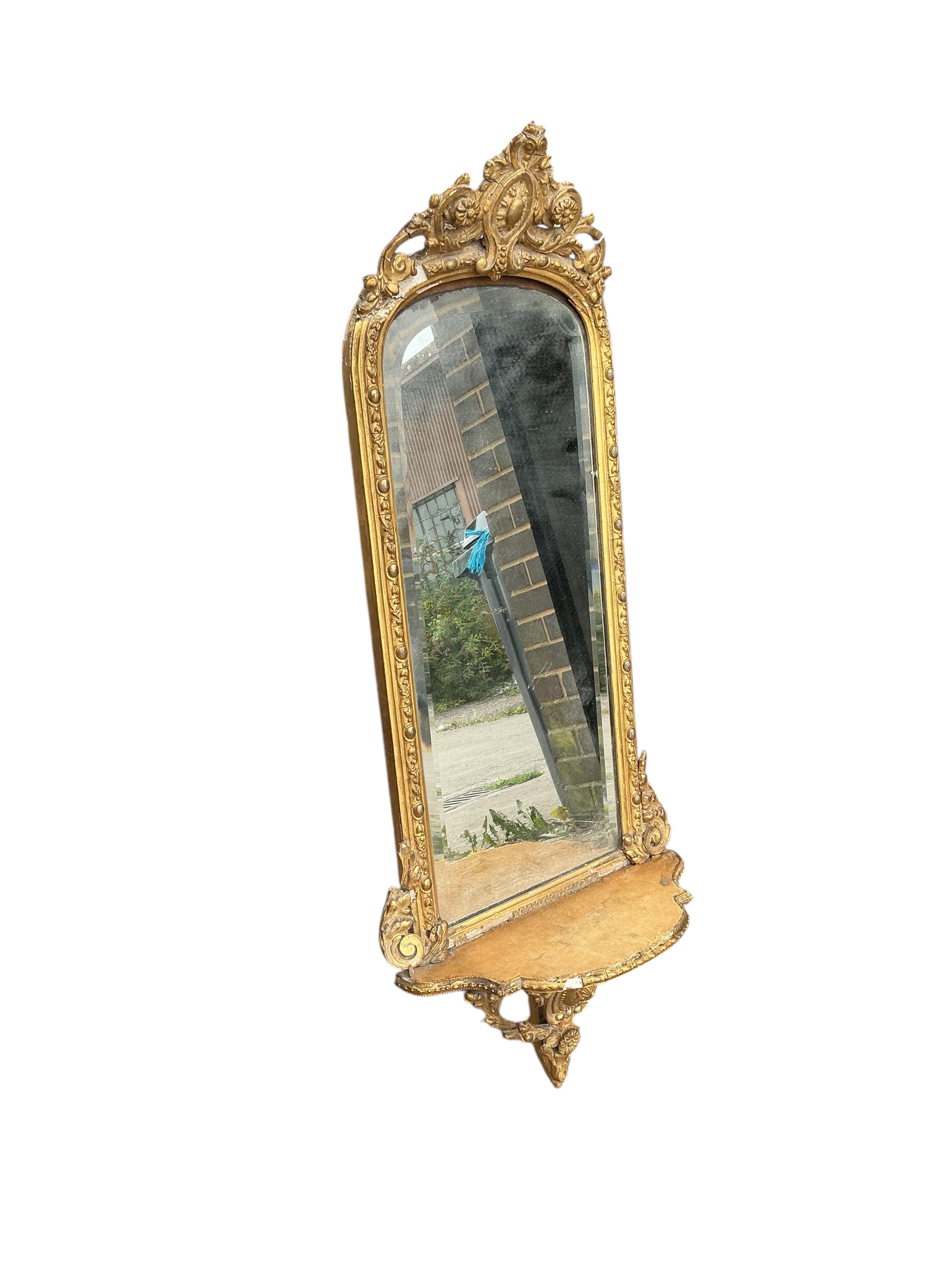 A Victorian giltwood and composition wall mirror, width 38cm, height 96cm, some damage